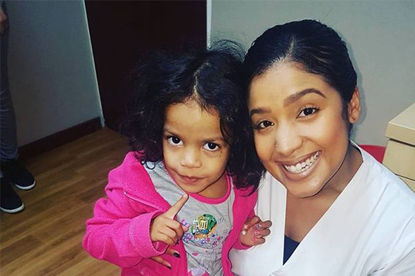 Dr Nichole Hendricks with young child, Dentico