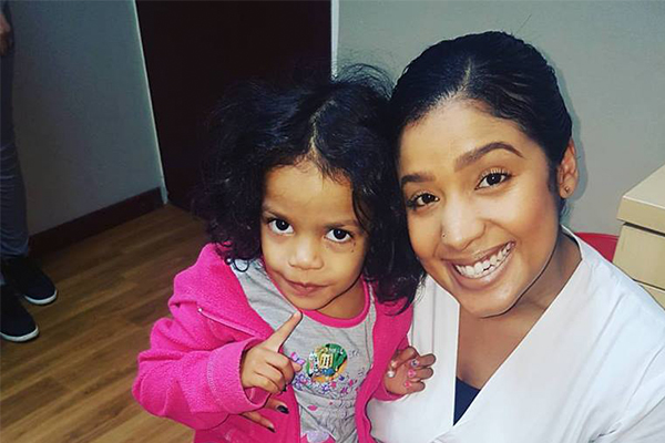 Dr Nichole Hendricks with young child, Dentico