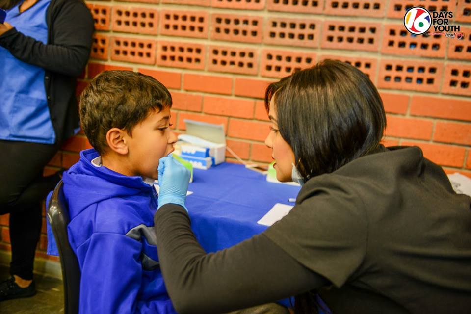 Dr Nichole Hendricks working with the kids, Dentico